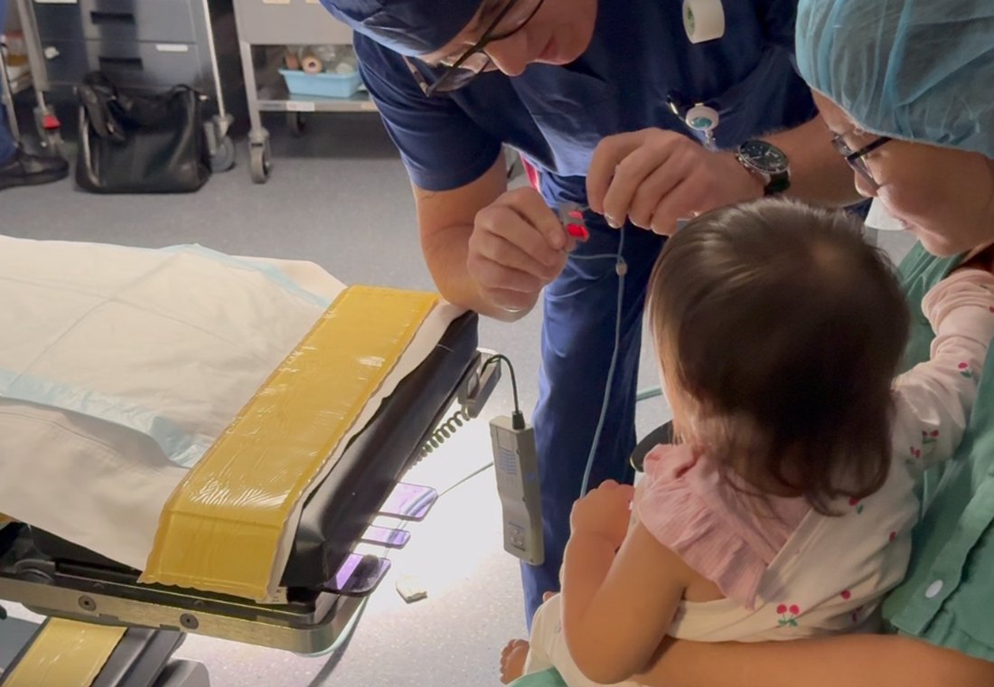 Clinician reassuring a child